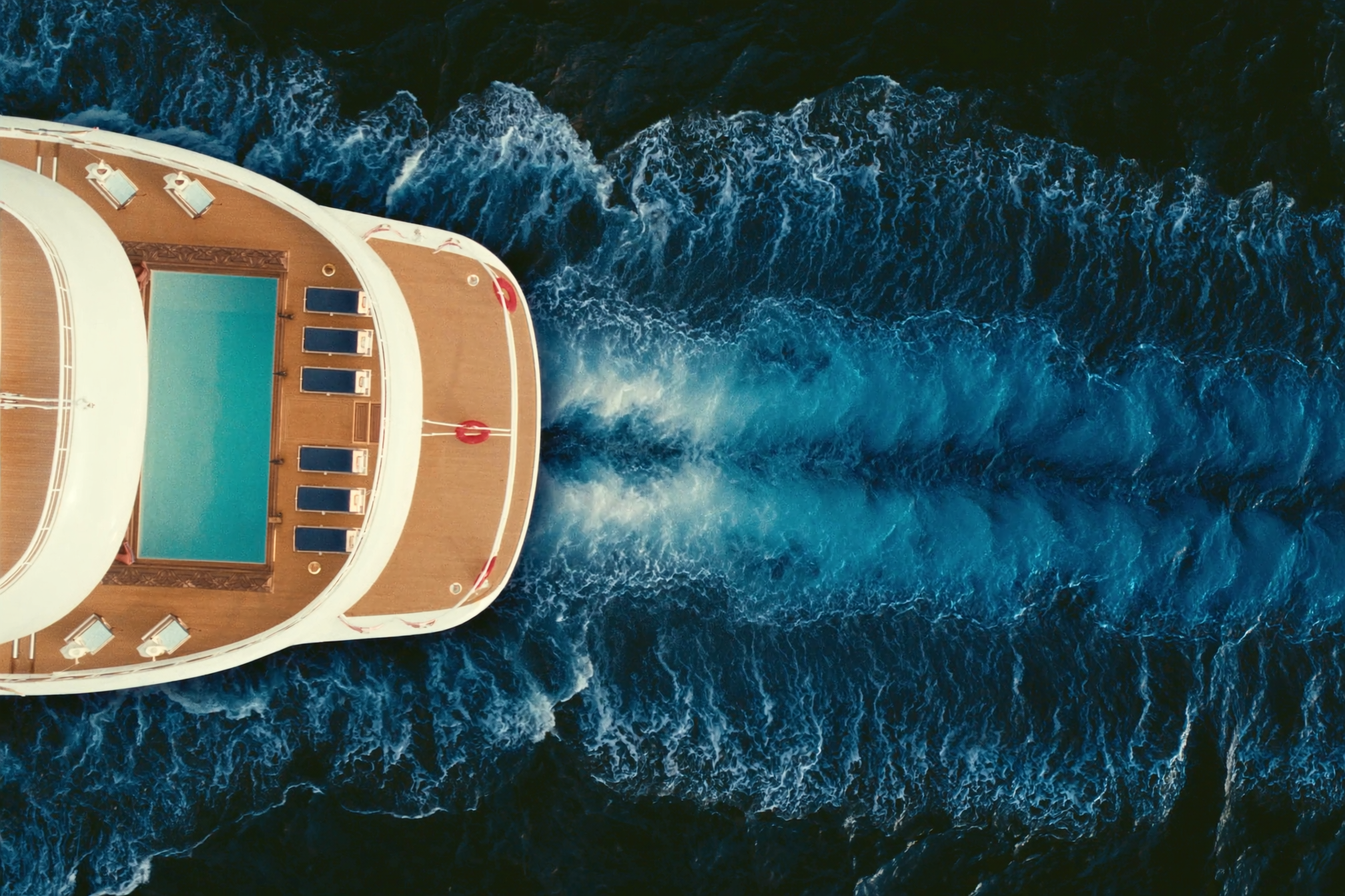 Aerial view of a superyacht sun deck and pool under way