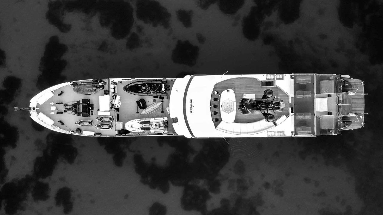 A classic explorer superyacht, shown in black and white